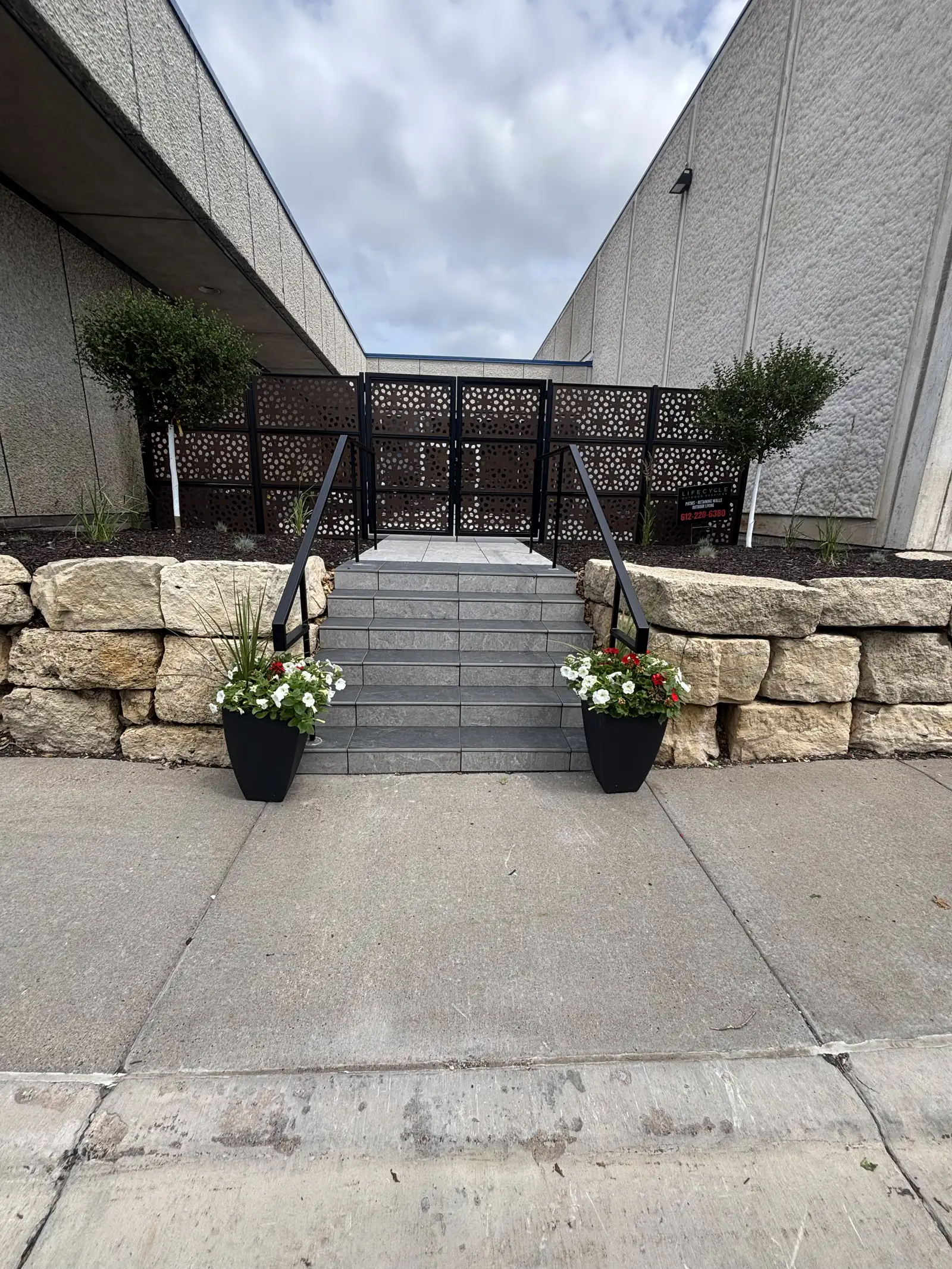 Commercial entrance patio — privacy screen detail
