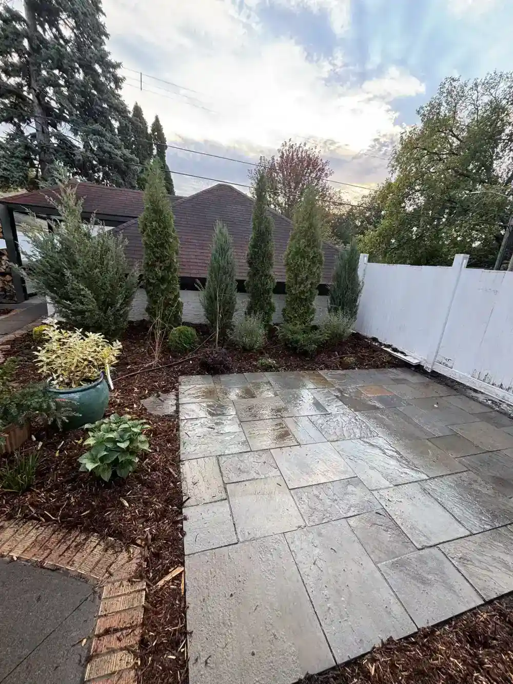 Full-color bluestone patio with custom plantings in Edina, MN