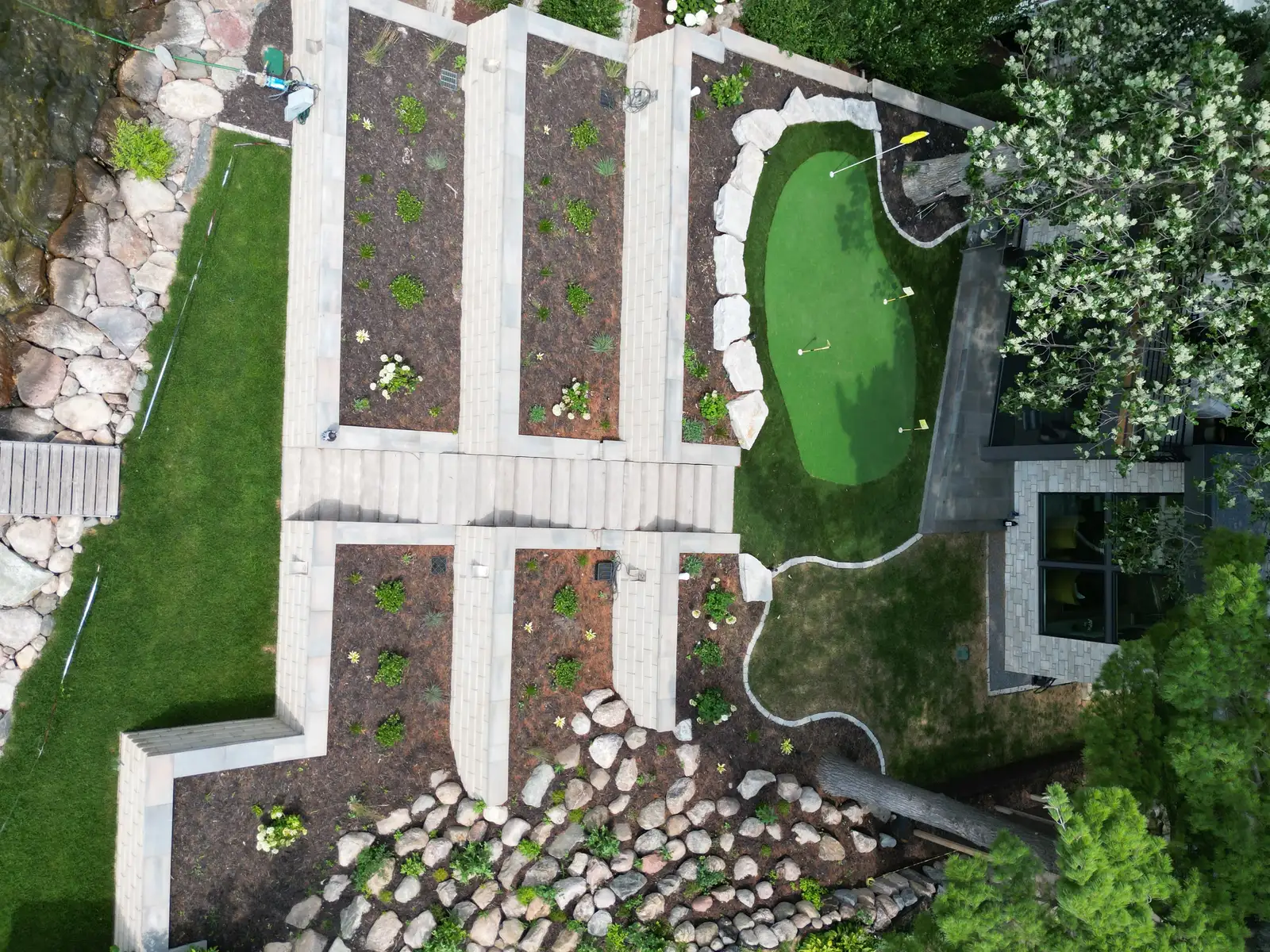 Three-tier retaining wall system built by Lifecycle Outdoor Services on Lake Minnetonka