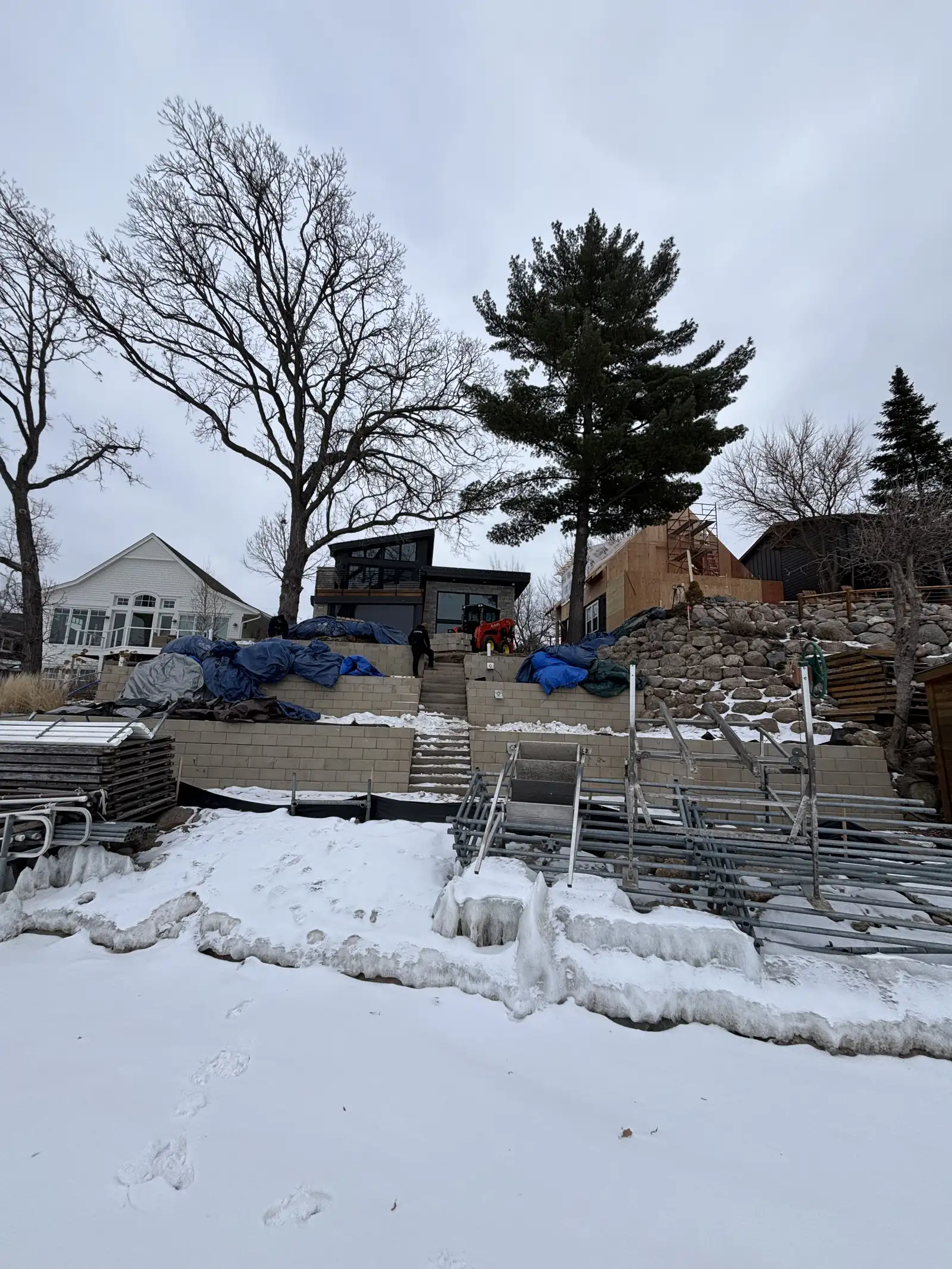 Custom landscape lighting installation on retaining wall in Excelsior, MN