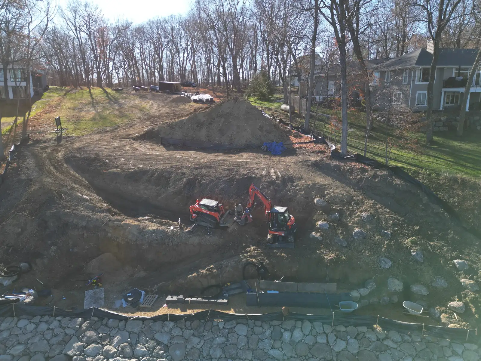 Mound shoreline stabilization — retaining wall construction