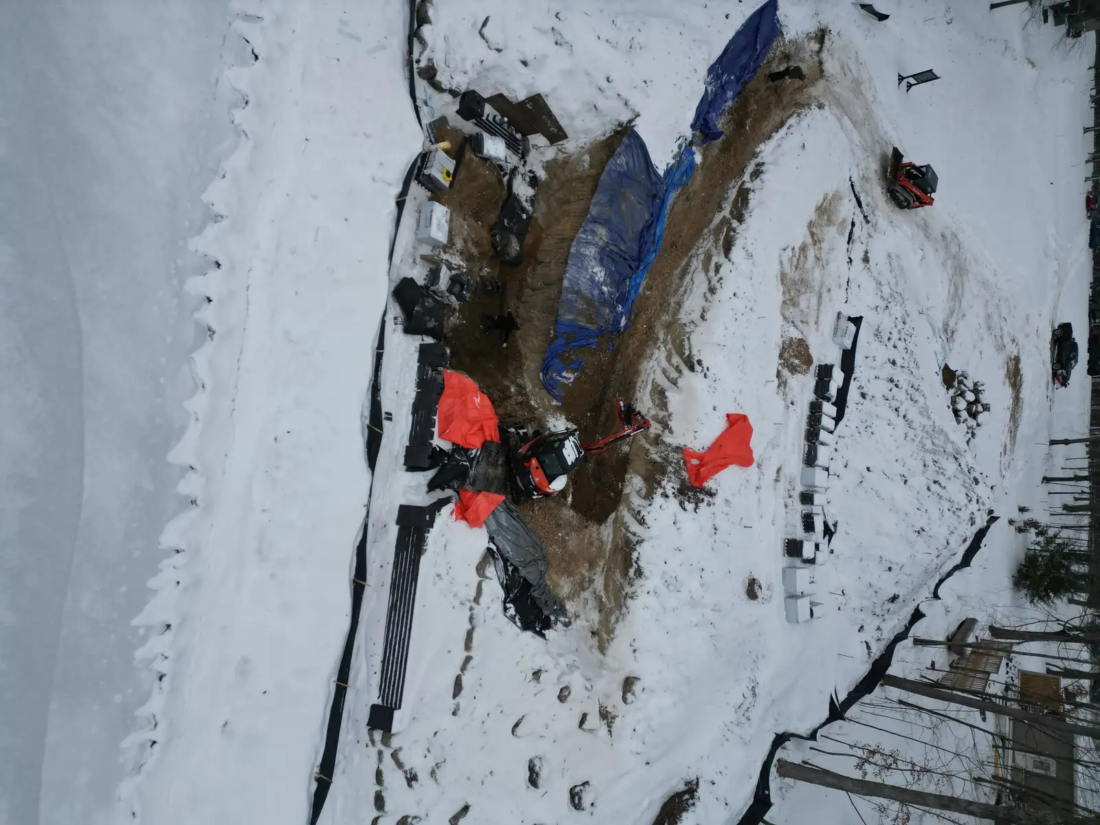 Mound shoreline stabilization — boulder outcroppings