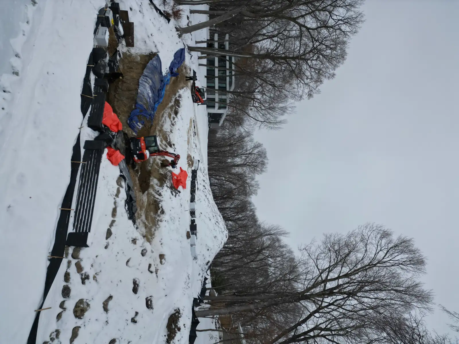 Retaining wall construction showing proper base preparation and drainage at Lake Minnetonka