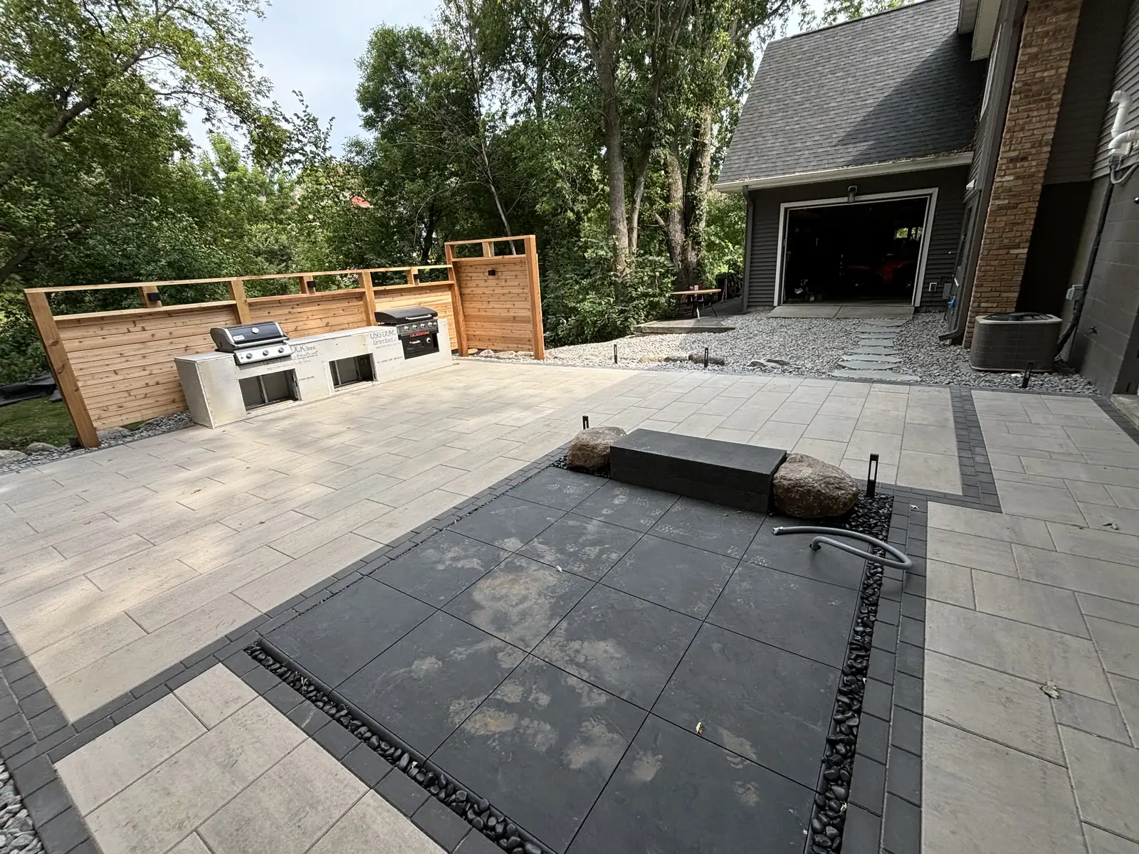 Cedar privacy screening and hot tub area at outdoor living space in Waconia, MN